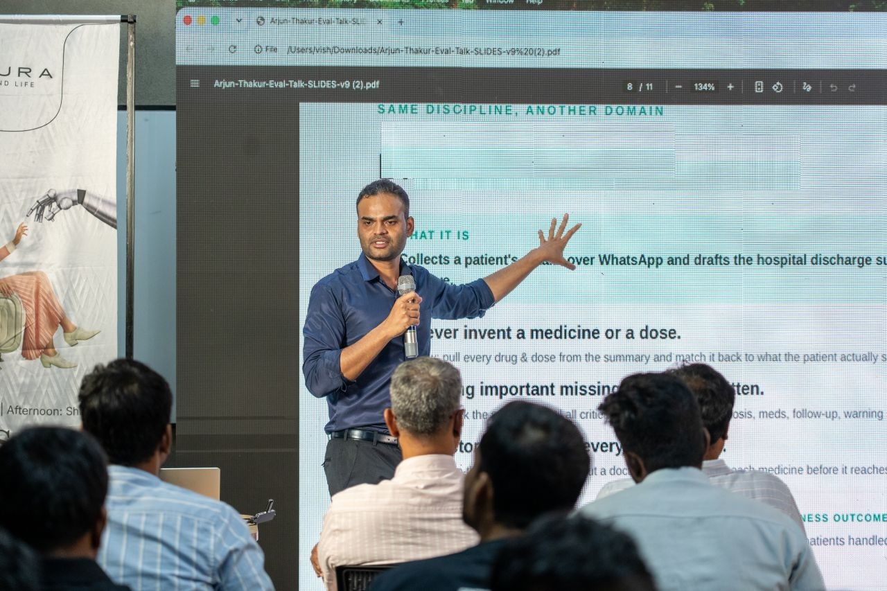 Arjun Thakur speaking on AI Evaluations at Ship Sabha, hosted by Amura Health, Chennai